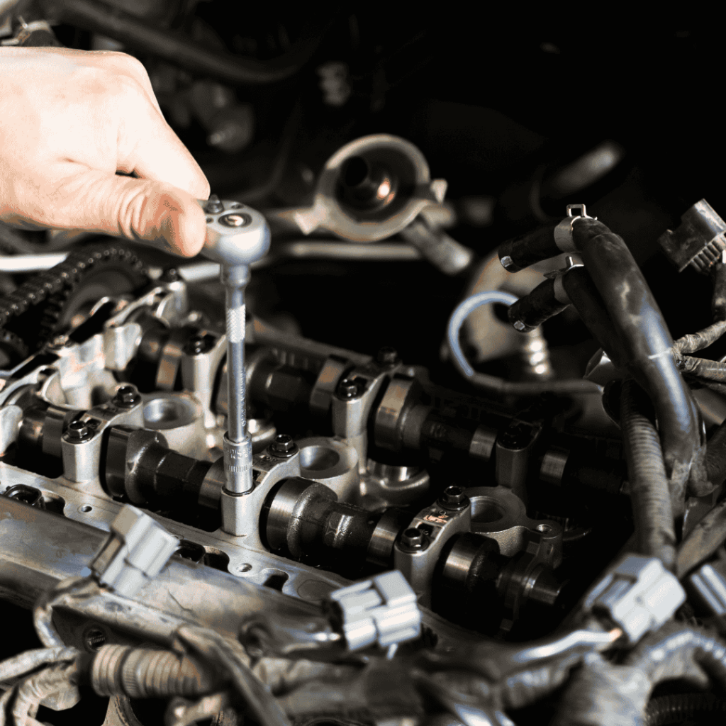 mechanic replacing an engine